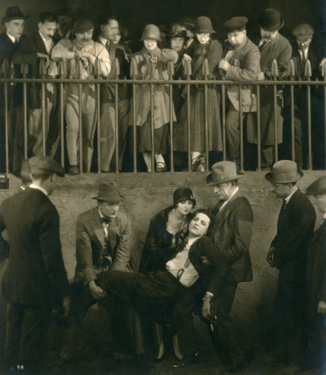 Ivor Novello and June Tripp (centre) in The Lodger (1926). Malcolm Keen is holding Ivor's legs.